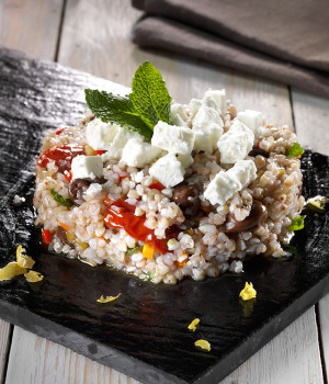 Buckwheat salad with vegetables, olives and feta