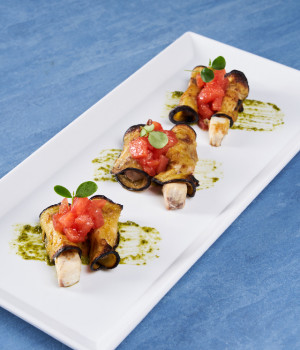 SWORDFISH ROLLED IN EGGPLANT WITH TOMATO CONCASSÉ AND FRESH GENOESE PESTO