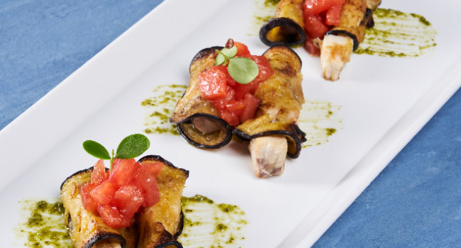 SWORDFISH ROLLED IN EGGPLANT WITH TOMATO CONCASSÉ AND FRESH GENOESE PESTO