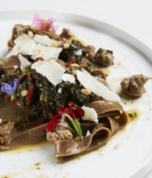 LIQUORICE TAGLIATELLE WITH TURNIP TOPS,  SAUSAGE AND TOASTED PINE NUTS
